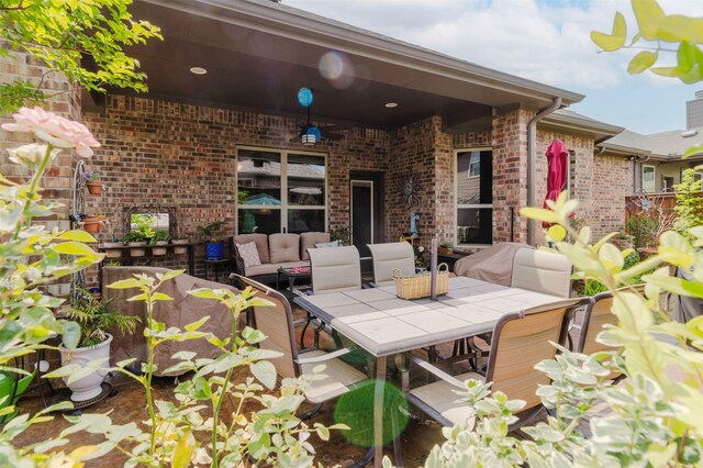 view of patio / terrace with outdoor dining area and an outdoor hangout area
