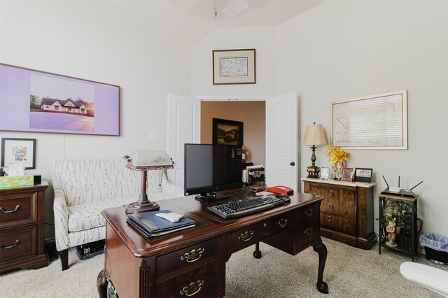 office space featuring high vaulted ceiling and light carpet