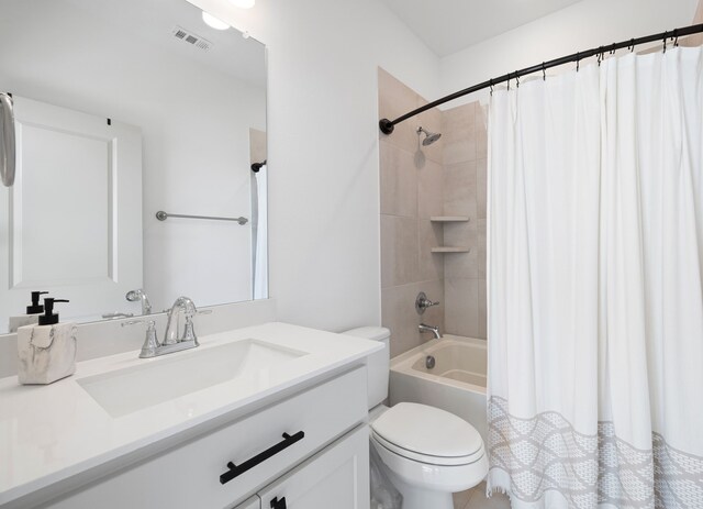 full bathroom with vanity, shower / tub combo with curtain, toilet, and visible vents