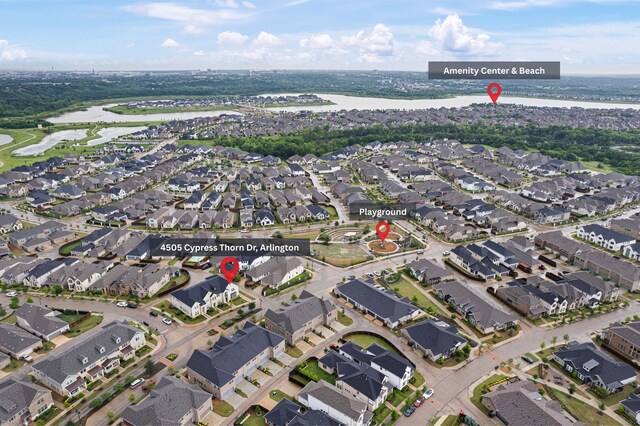 bird's eye view with a residential view and a water view