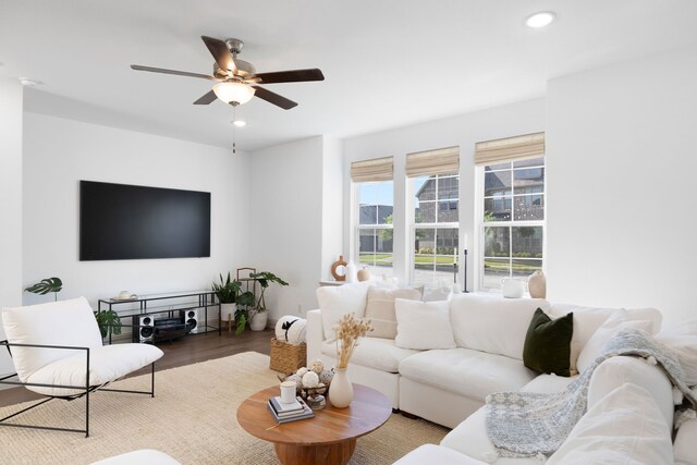 living area with recessed lighting, ceiling fan, and wood finished floors