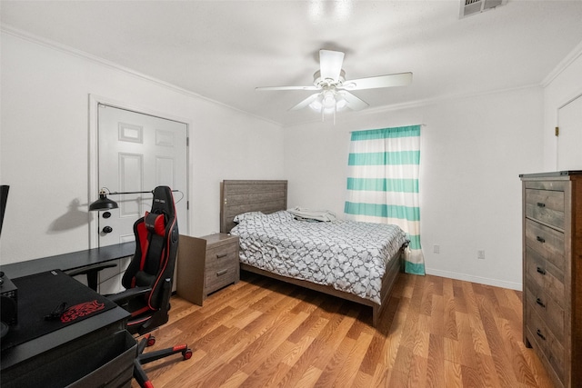517 Curts Dr, Grand Prairie, TX 75052 - bedroom featuring crown molding, visible vents, baseboards, a ceiling fan, and light wood-style flooring