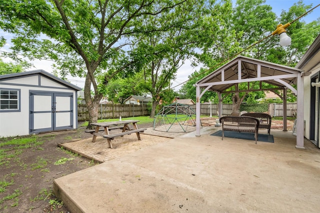517 Curts Dr, Grand Prairie, TX 75052 - view of patio / terrace featuring a fenced backyard, an outdoor structure, a gazebo, and a shed