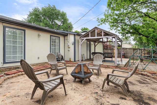 517 Curts Dr, Grand Prairie, TX 75052 - view of patio / terrace with a fenced backyard, a gazebo, and a fire pit