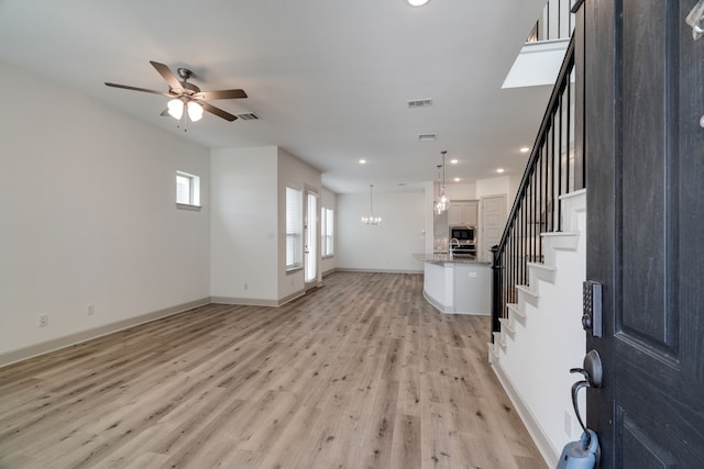 4402 Cypress Thorn Dr, Arlington, TX 76005 - unfurnished living room featuring stairway, light wood finished floors, ceiling fan, baseboards, and recessed lighting