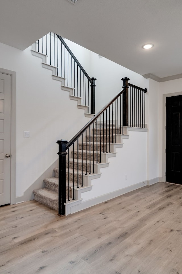 4402 Cypress Thorn Dr, Arlington, TX 76005 - stairway featuring wood finished floors, baseboards, and recessed lighting