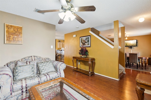 3065 Coolwood Ln, Rockwall, TX 75032 - living room with wood finished floors, a ceiling fan, baseboards, and stairs