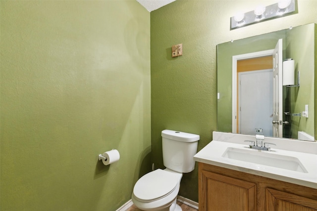 3065 Coolwood Ln, Rockwall, TX 75032 - half bathroom with toilet, vanity, and baseboards