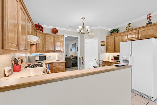 113 Ginger Dr, Pottsboro, TX 75076 - kitchen featuring white appliances, under cabinet range hood, a chandelier, tasteful backsplash, and light countertops