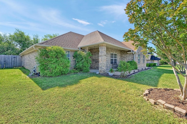 113 Ginger Dr, Pottsboro, TX 75076 - view of side of home with brick siding and roof with shingles