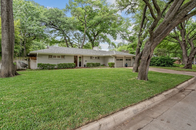 3200 Spanish Oak Dr, Fort Worth, TX 76109 - single story home with fence, an attached garage, a front lawn, a chimney, and concrete driveway