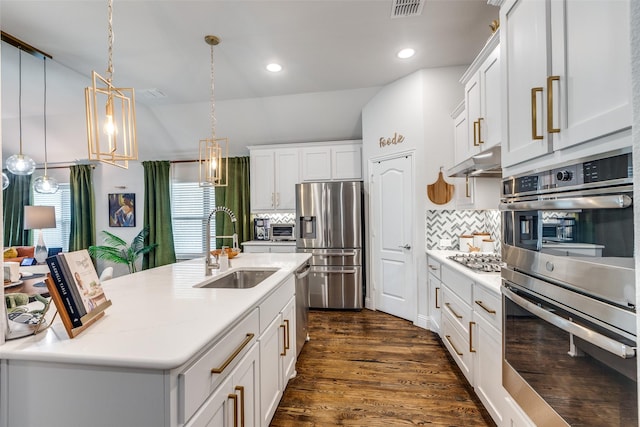 kitchen with visible vents, stainless steel appliances, a sink, light countertops, and under cabinet range hood