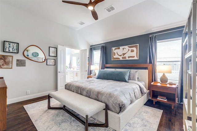 bedroom featuring visible vents, baseboards, lofted ceiling, and dark wood-style floors