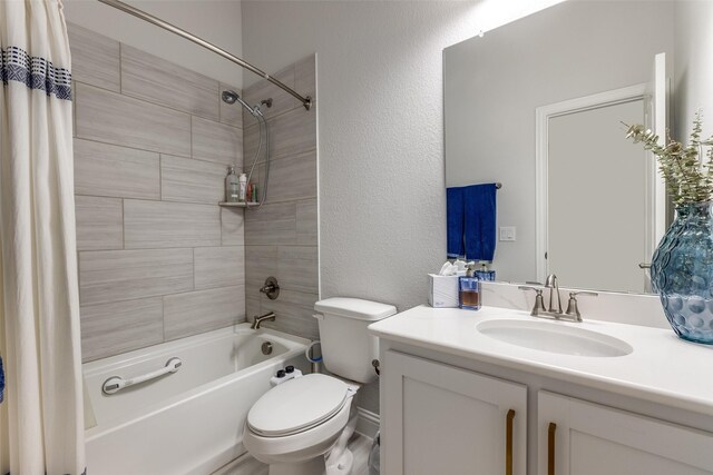 full bath featuring vanity, a textured wall, toilet, and shower / bathtub combination with curtain