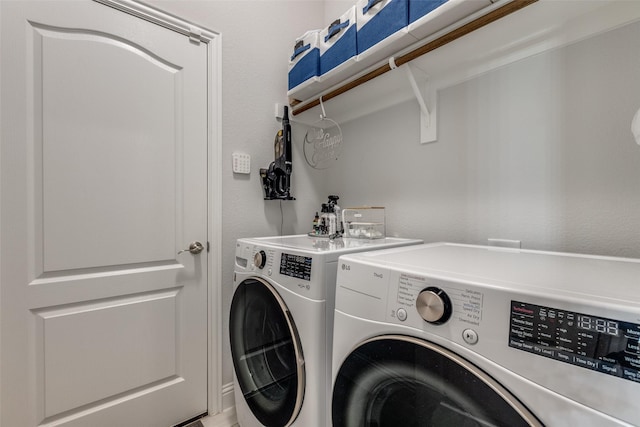 laundry area featuring laundry area and washer and dryer