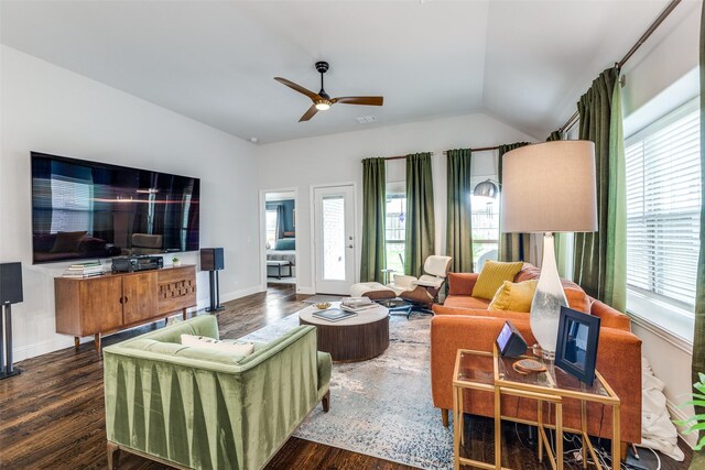 living room featuring ceiling fan, vaulted ceiling, plenty of natural light, and wood finished floors