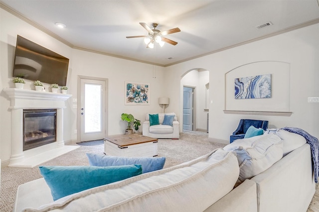 8357 Blue Periwinkle Ln, Fort Worth, TX 76123 - living room with ceiling fan, visible vents, arched walkways, ornamental molding, and carpet