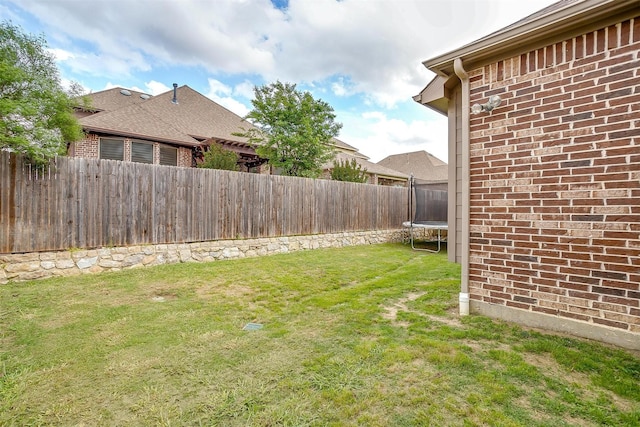 8357 Blue Periwinkle Ln, Fort Worth, TX 76123 - view of yard with a fenced backyard and a trampoline
