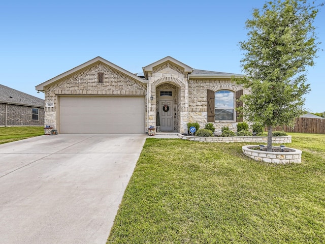 french country home featuring driveway, a front yard, brick siding, fence, and an attached garage