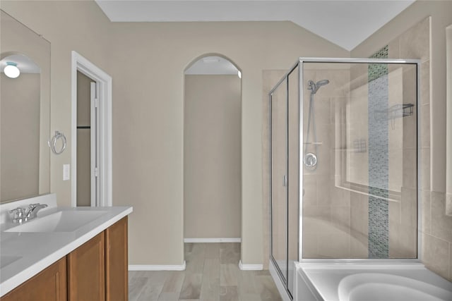 5320 Creek Hill Ln, Fort Worth, TX 76179 - full bath featuring a stall shower, wood finished floors, double vanity, a bathtub, and baseboards
