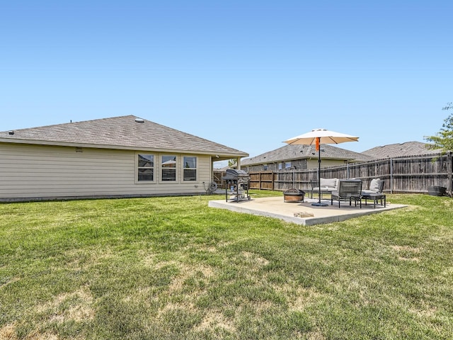 back of property with fence, a patio, and a yard