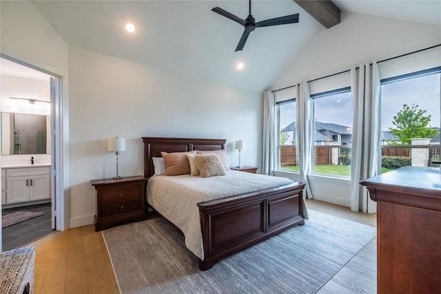 1400 Island Vista Dr, Arlington, TX 76005 - bedroom featuring connected bathroom, a sink, recessed lighting, vaulted ceiling with beams, and light wood-type flooring