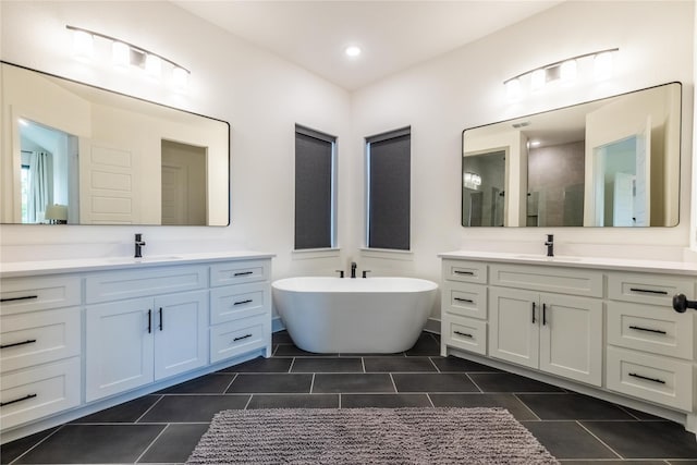 1400 Island Vista Dr, Arlington, TX 76005 - bathroom featuring a sink, a freestanding tub, tile patterned flooring, and a tile shower