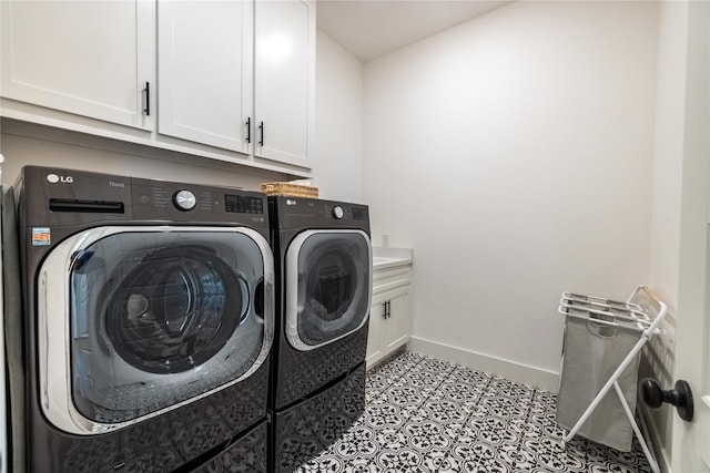 1400 Island Vista Dr, Arlington, TX 76005 - laundry room featuring baseboards, washing machine and dryer, and cabinet space