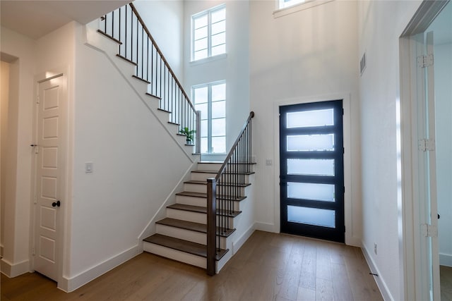 1400 Island Vista Dr, Arlington, TX 76005 - entryway with visible vents, a high ceiling, wood finished floors, and stairway