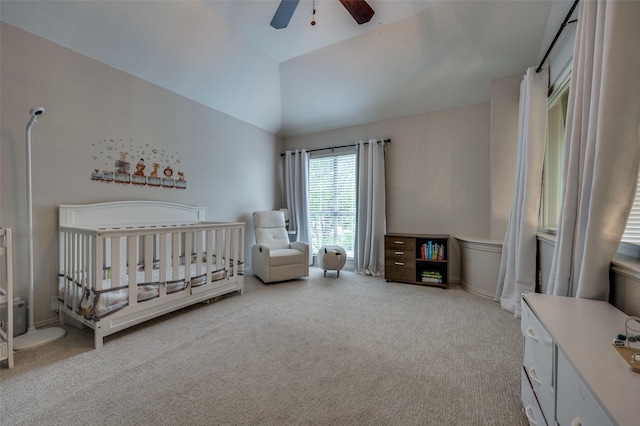 8909 White Pine Ln, Dallas, TX 75238 - carpeted bedroom with a nursery area, vaulted ceiling, and ceiling fan