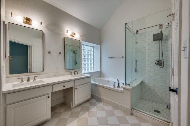 8909 White Pine Ln, Dallas, TX 75238 - full bath with vaulted ceiling, tile patterned floors, a stall shower, a garden tub, and double vanity