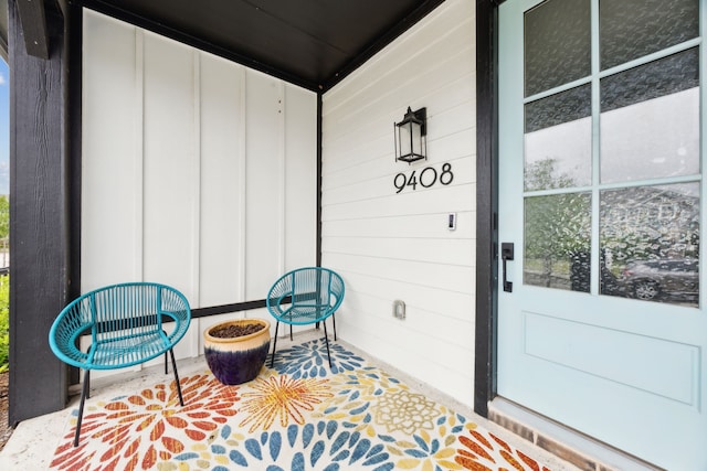 9408 Lamar St Unit D, Rowlett, TX 75089 - doorway to property featuring board and batten siding