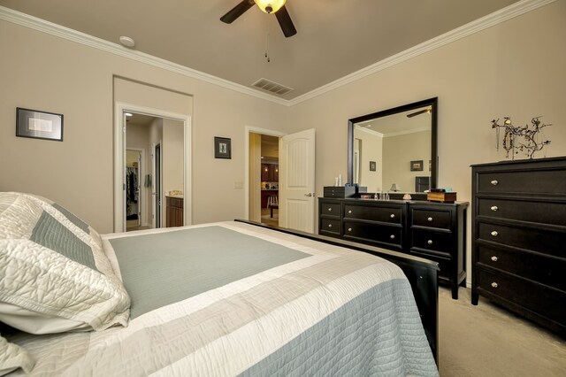 bedroom with ornamental molding, light carpet, ceiling fan, and visible vents