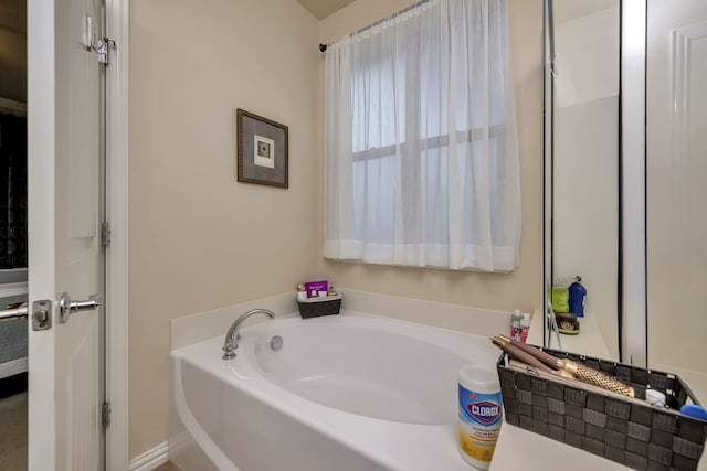12521 Gritstone Dr, Denton, TX 76207 - bathroom featuring a garden tub