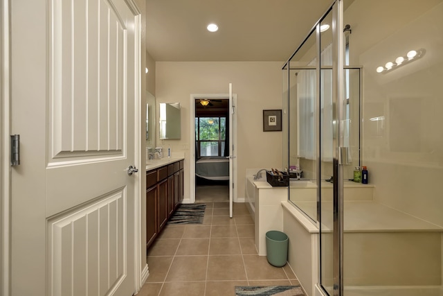 12521 Gritstone Dr, Denton, TX 76207 - bathroom featuring a shower stall, tile patterned flooring, vanity, a ceiling fan, and a bath