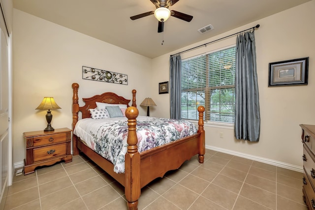 12521 Gritstone Dr, Denton, TX 76207 - bedroom with multiple windows, baseboards, and light tile patterned floors