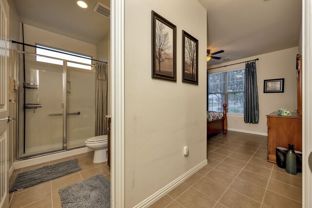 bathroom with tile patterned floors, baseboards, a stall shower, and visible vents