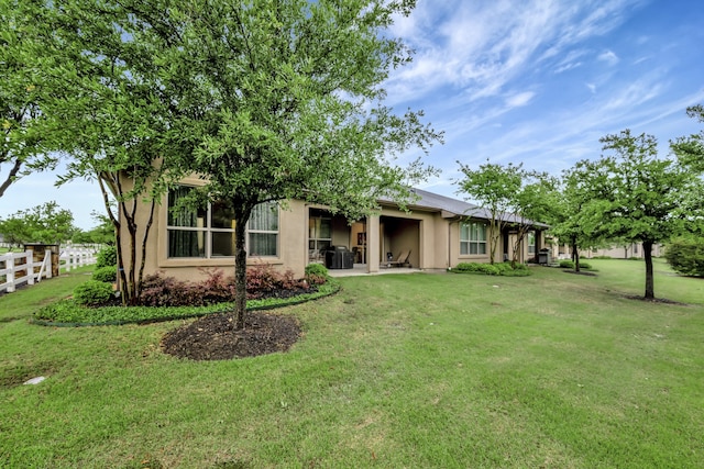 12521 Gritstone Dr, Denton, TX 76207 - rear view of house featuring stucco siding, a patio area, and cooling unit