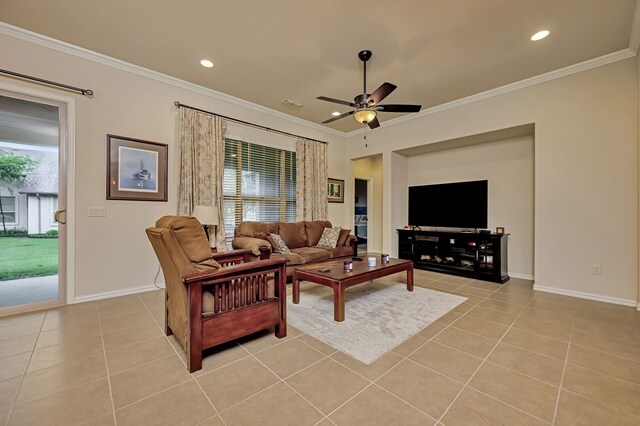 living area featuring baseboards, ornamental molding, a ceiling fan, and light tile patterned floors