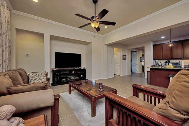 living room featuring light tile patterned flooring, a ceiling fan, recessed lighting, and ornamental molding
