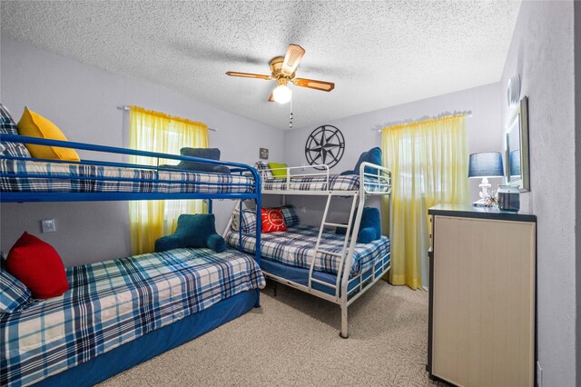 carpeted bedroom featuring a textured ceiling