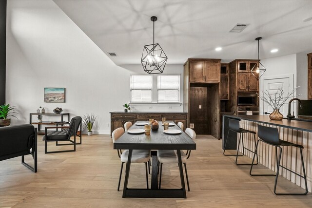 3805 Bluestem Blvd, Denton, TX 76226 - dining room with light wood finished floors and recessed lighting