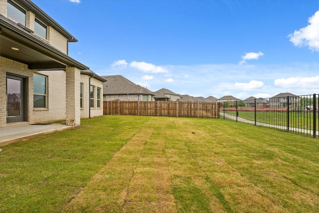 3805 Bluestem Blvd, Denton, TX 76226 - fenced backyard with a residential view and a patio