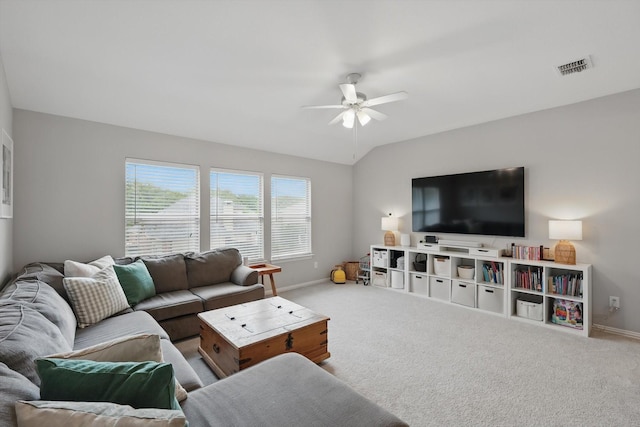 living area featuring carpet flooring, a ceiling fan, baseboards, and visible vents