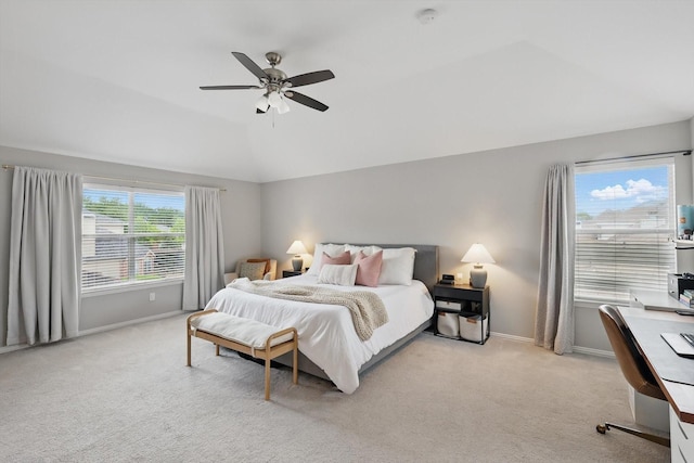 carpeted bedroom featuring a ceiling fan, baseboards, and vaulted ceiling