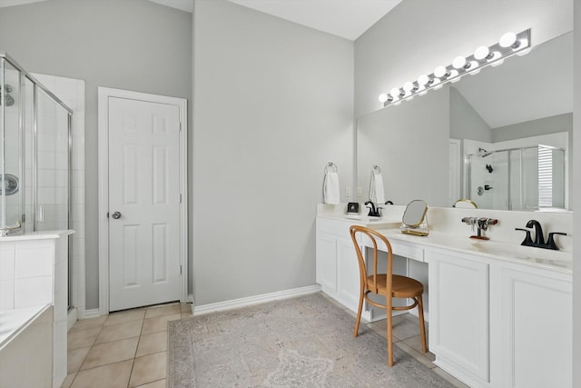 bathroom featuring tile patterned flooring, lofted ceiling, and a shower stall