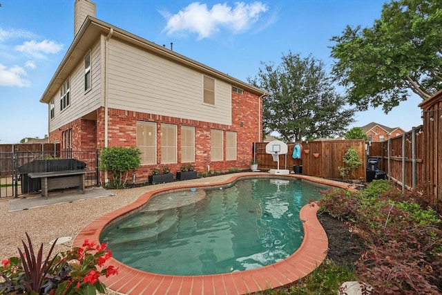 view of pool with a fenced in pool and a fenced backyard