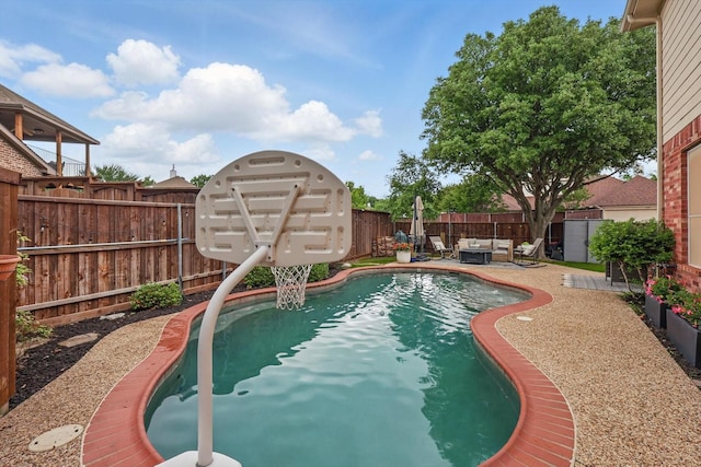 view of pool with a fenced backyard, a fenced in pool, a patio, and an outdoor hangout area