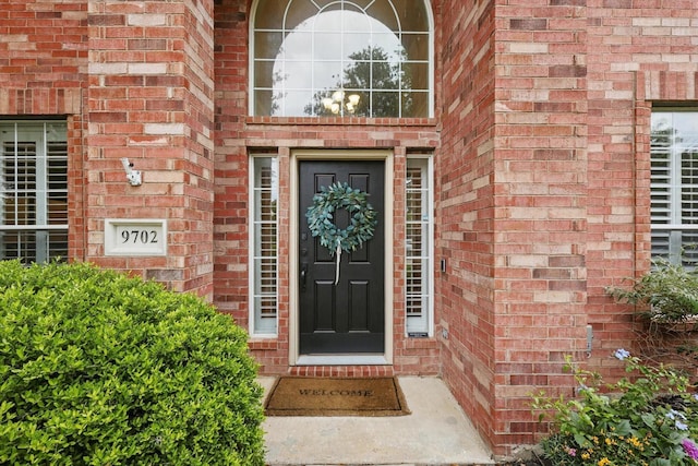 entrance to property with brick siding