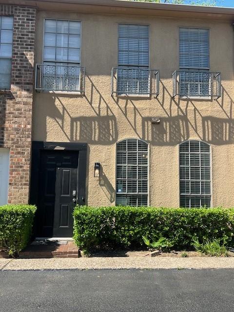 exterior space featuring stucco siding